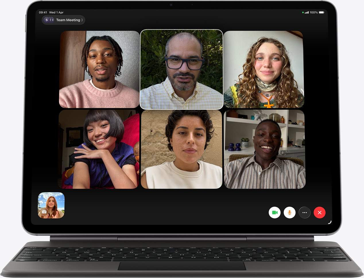 iPad Air, front exterior, Magic Keyboard, black colour, FaceTime call on the screen, multiple participants visible