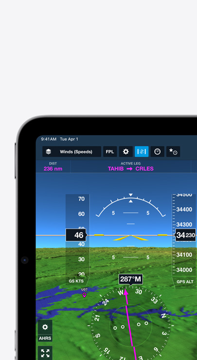 Un iPad affiche la vitesse et la direction du vent sur une carte de vol topographique avec des crêtes représentant des montagnes.